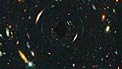 Gravitational Lens passing in front of Hubble Deep Field North